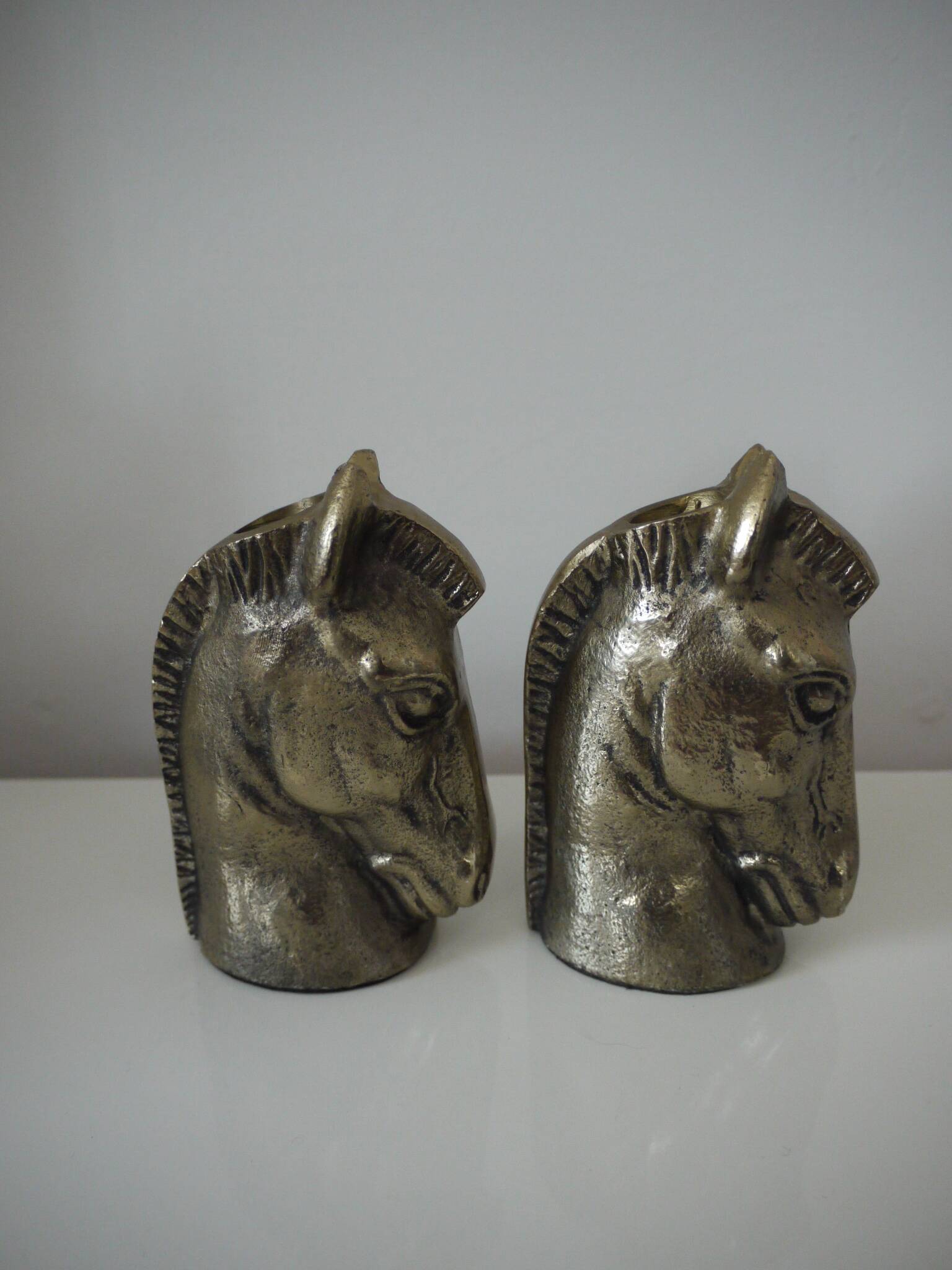 Set of two horse head candle holders.