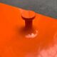 Orange coat rack from the mid-century space age, 1960s.