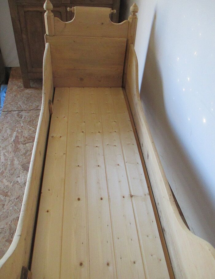 Retractable sofa bed of the Austrian Tyrole in natural wood