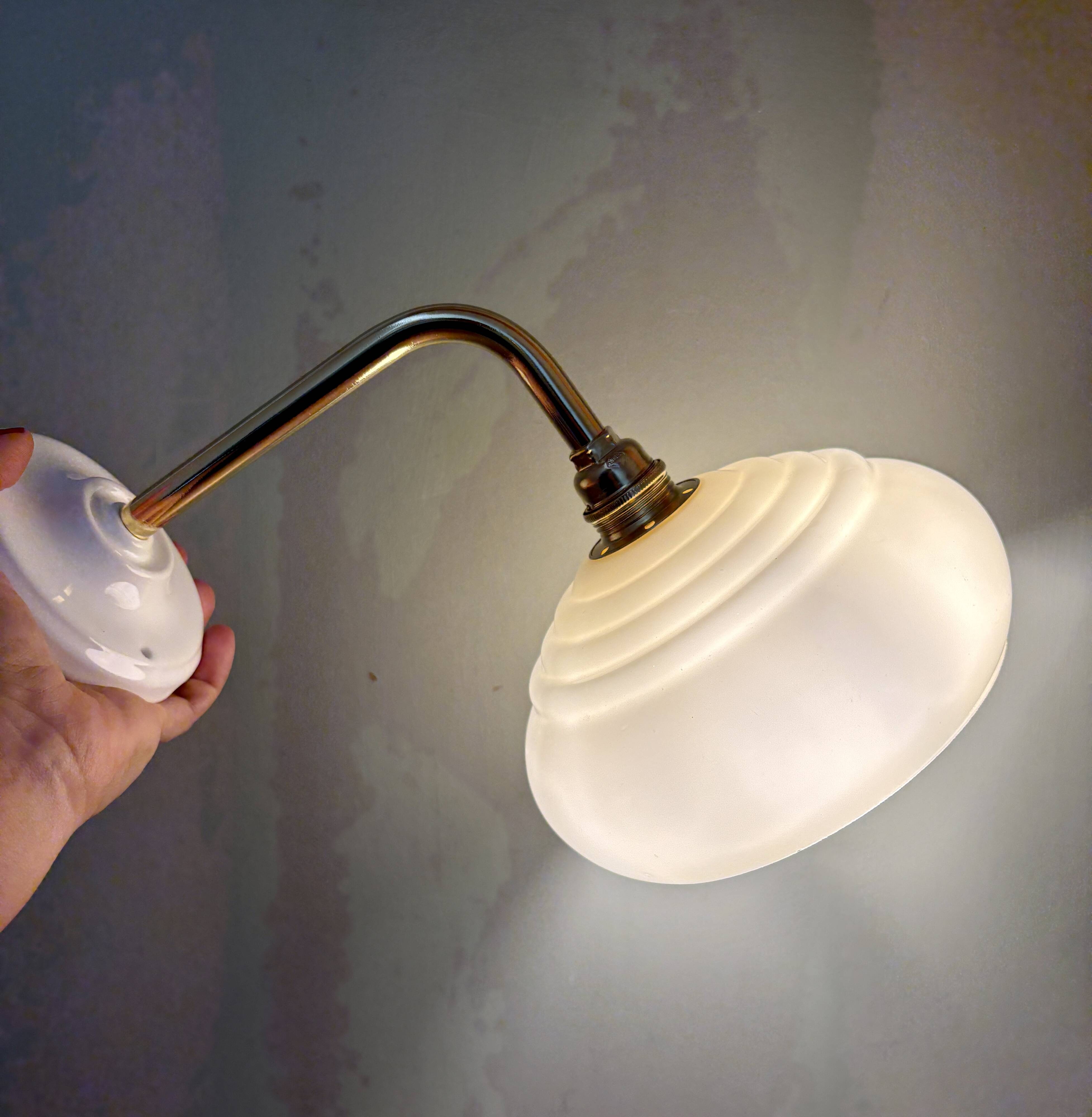 Vintage angled wall lamp with pale yellow opaline shade