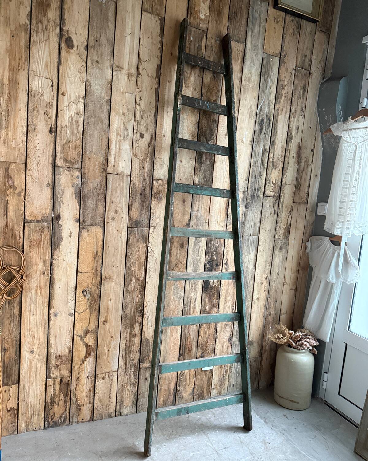 Antique ladder with green patina