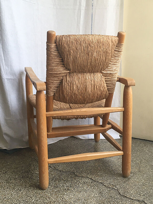 "Paillé" armchair by Charlotte Perriand