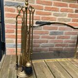 Old brass fireplace set and its fire screen grille