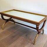 Coffee table in patinated and gilded carved wood with mirror top