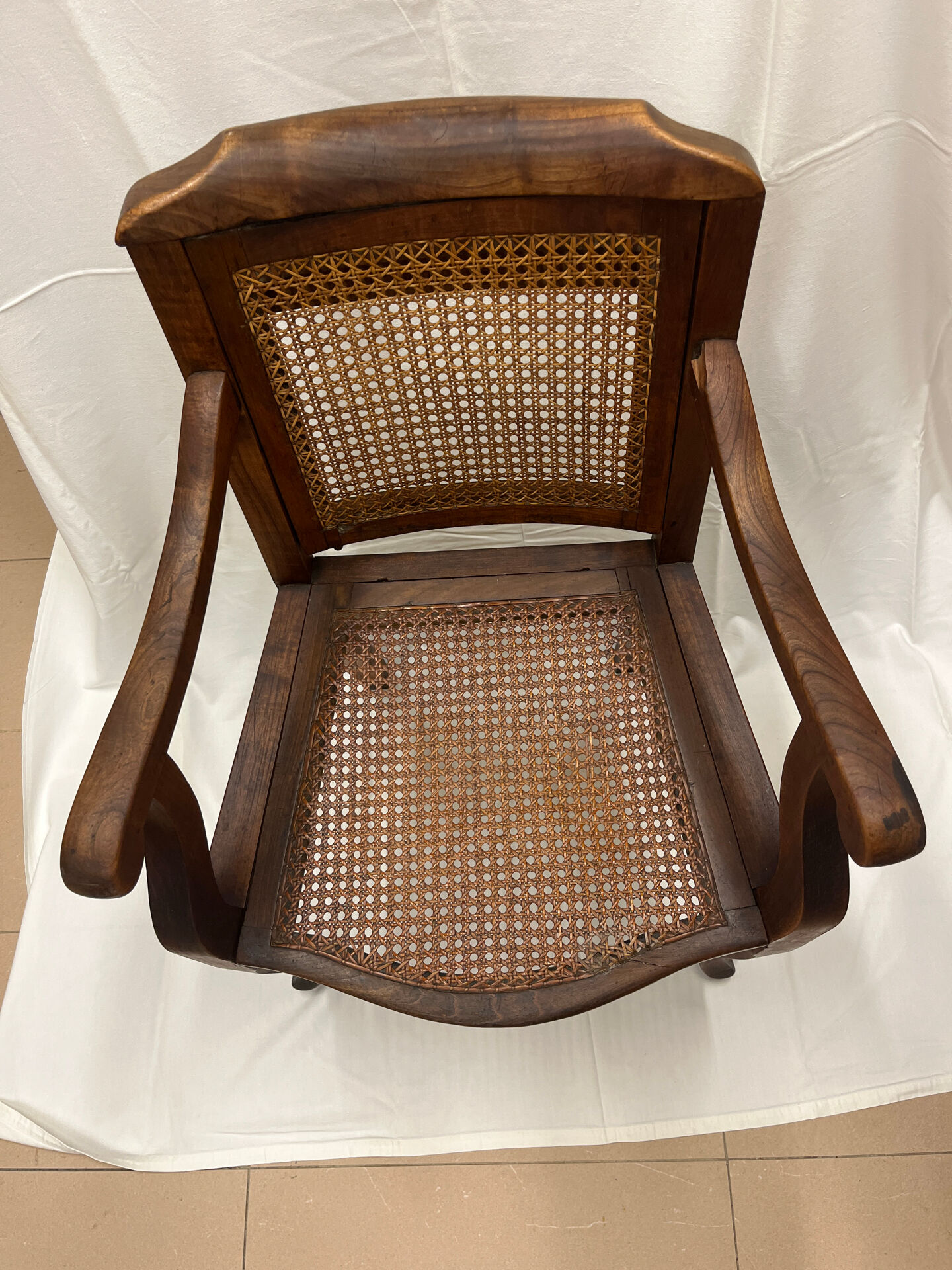 Caned armchair