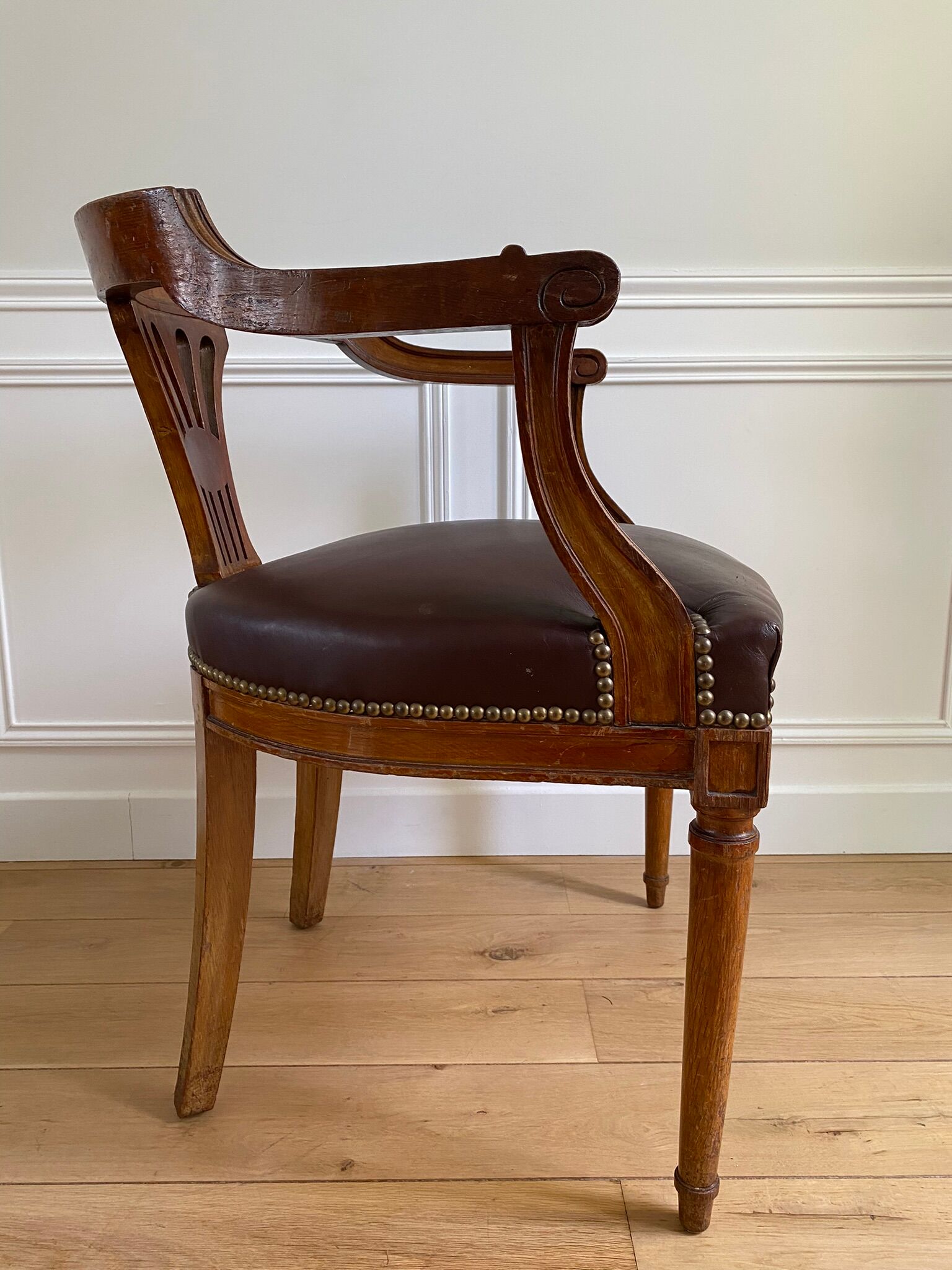 Vintage office chair in wood and brown studded leather late nineteenth