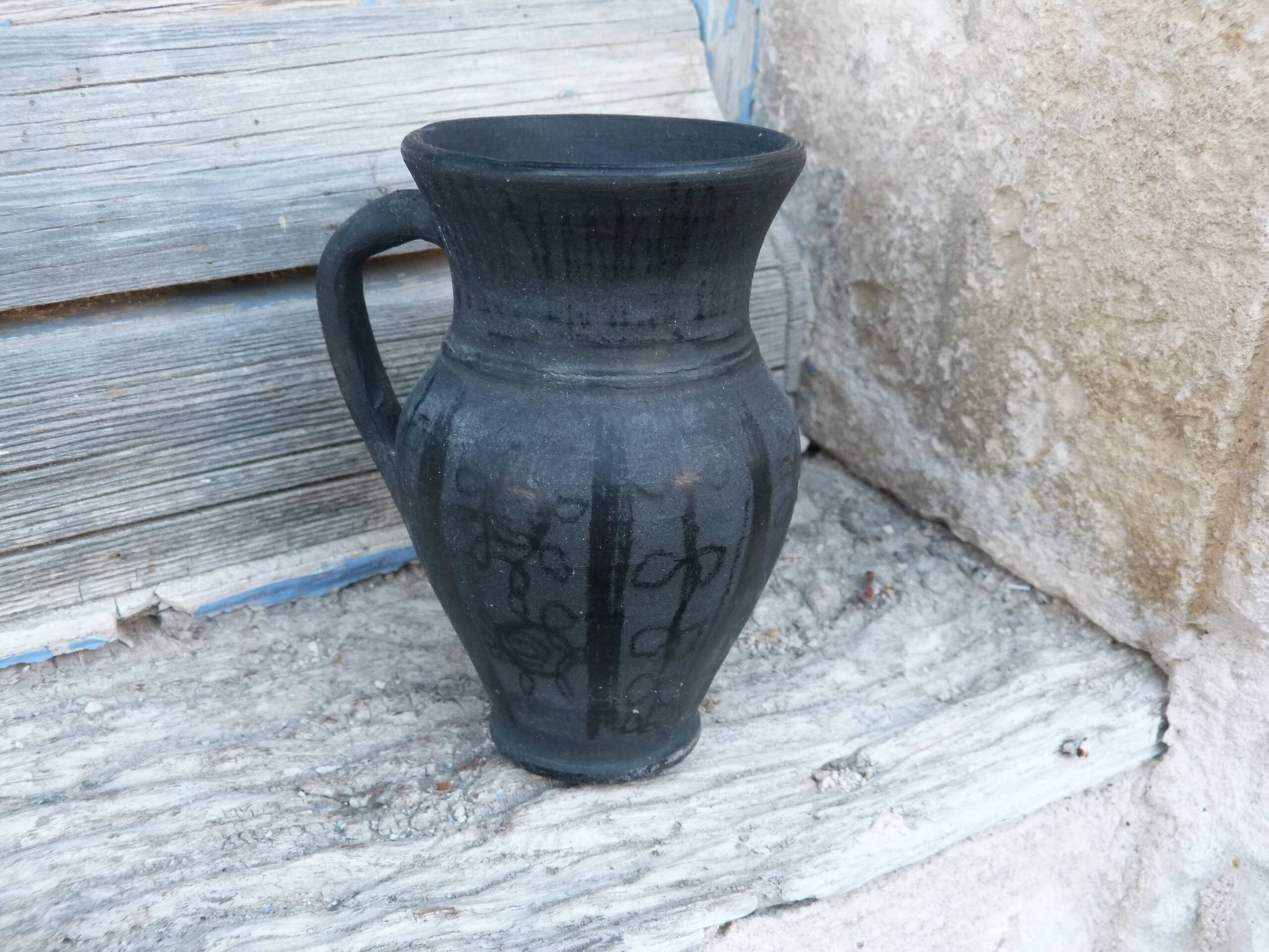 Pitcher in matte and glossy black pottery