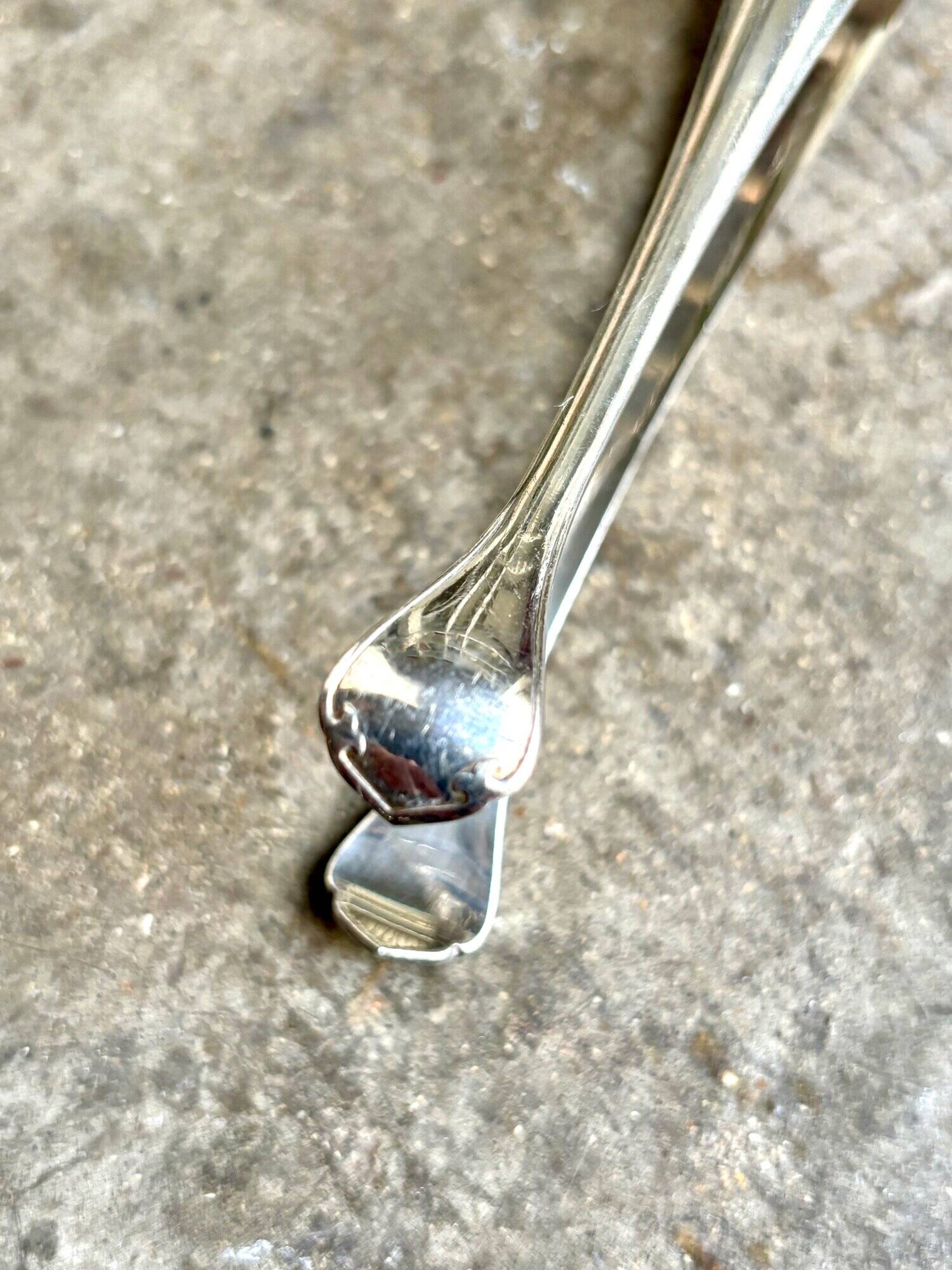 Christofle sugar tongs in silver metal