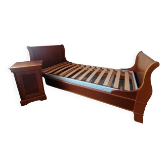 Bed with cherry wood base and bedside table