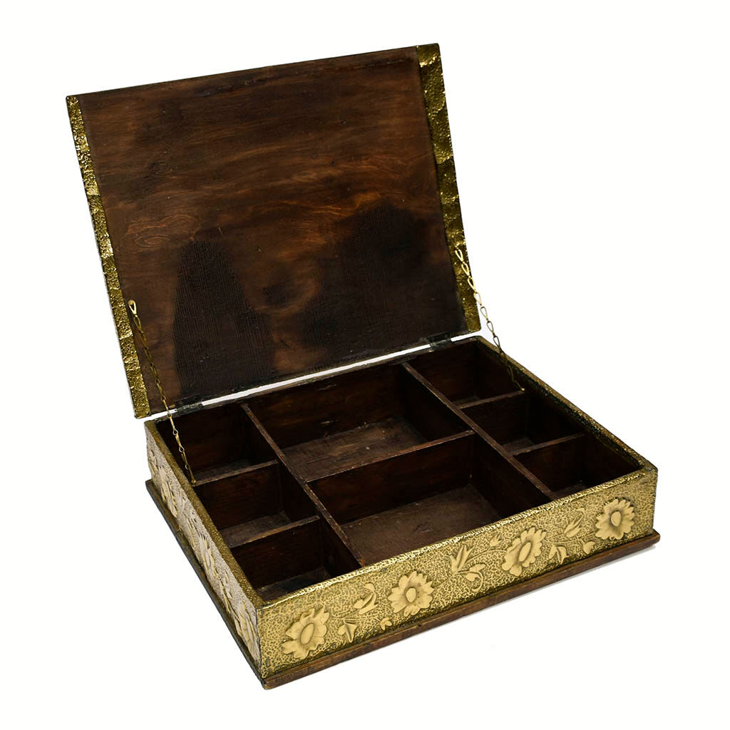 Old wooden box decorated with carved gold metal repelled vintage butterfly