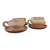 Stoneware cups with saucers