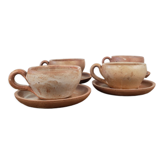 Stoneware cups with saucers
