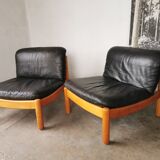 Pair of designer leather armchairs 80s