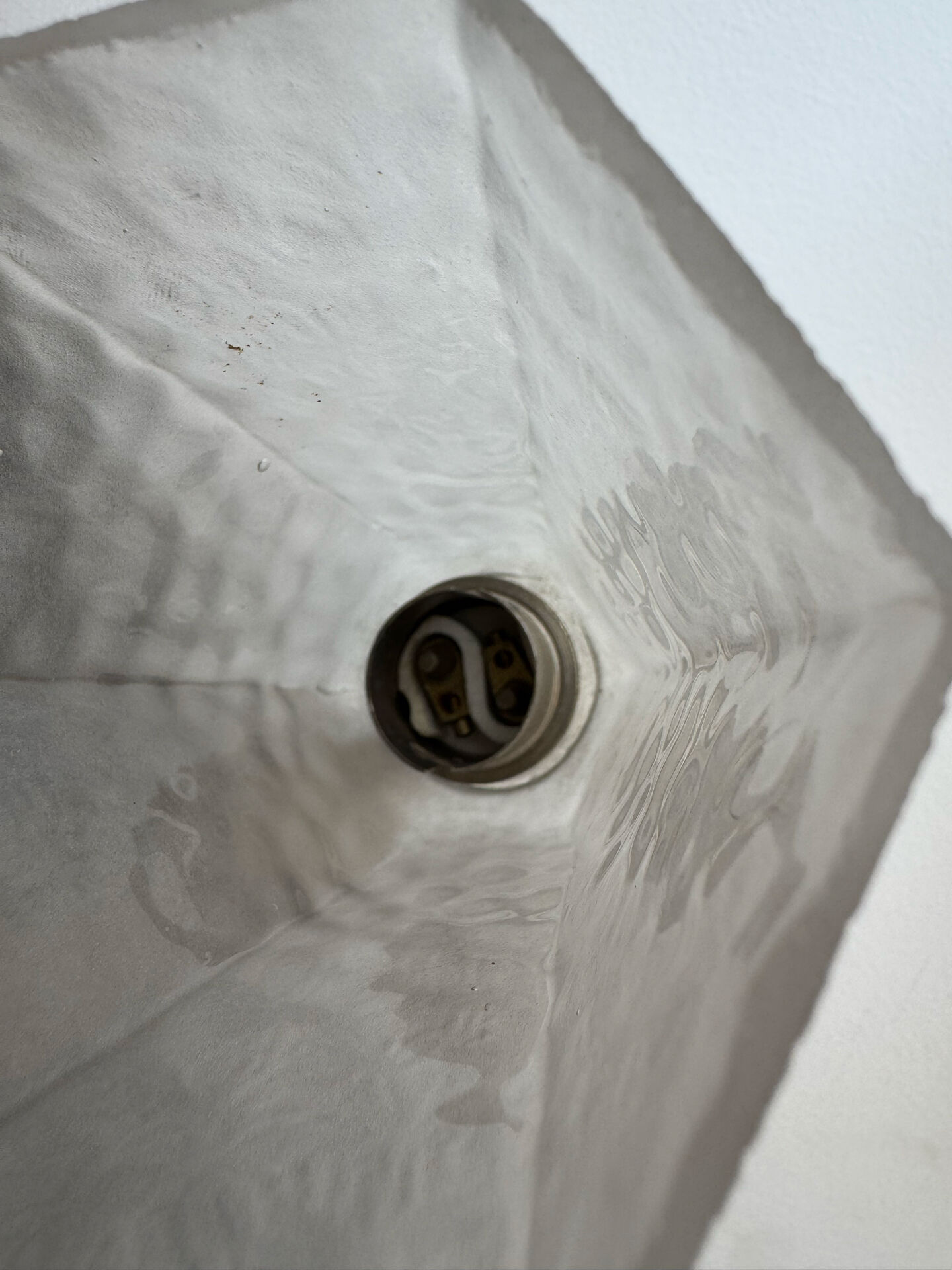 Silver Art Deco wall lights with frosted glass.