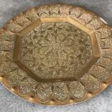 Oriental brass tray with chiseled decoration of arabesques and flowers