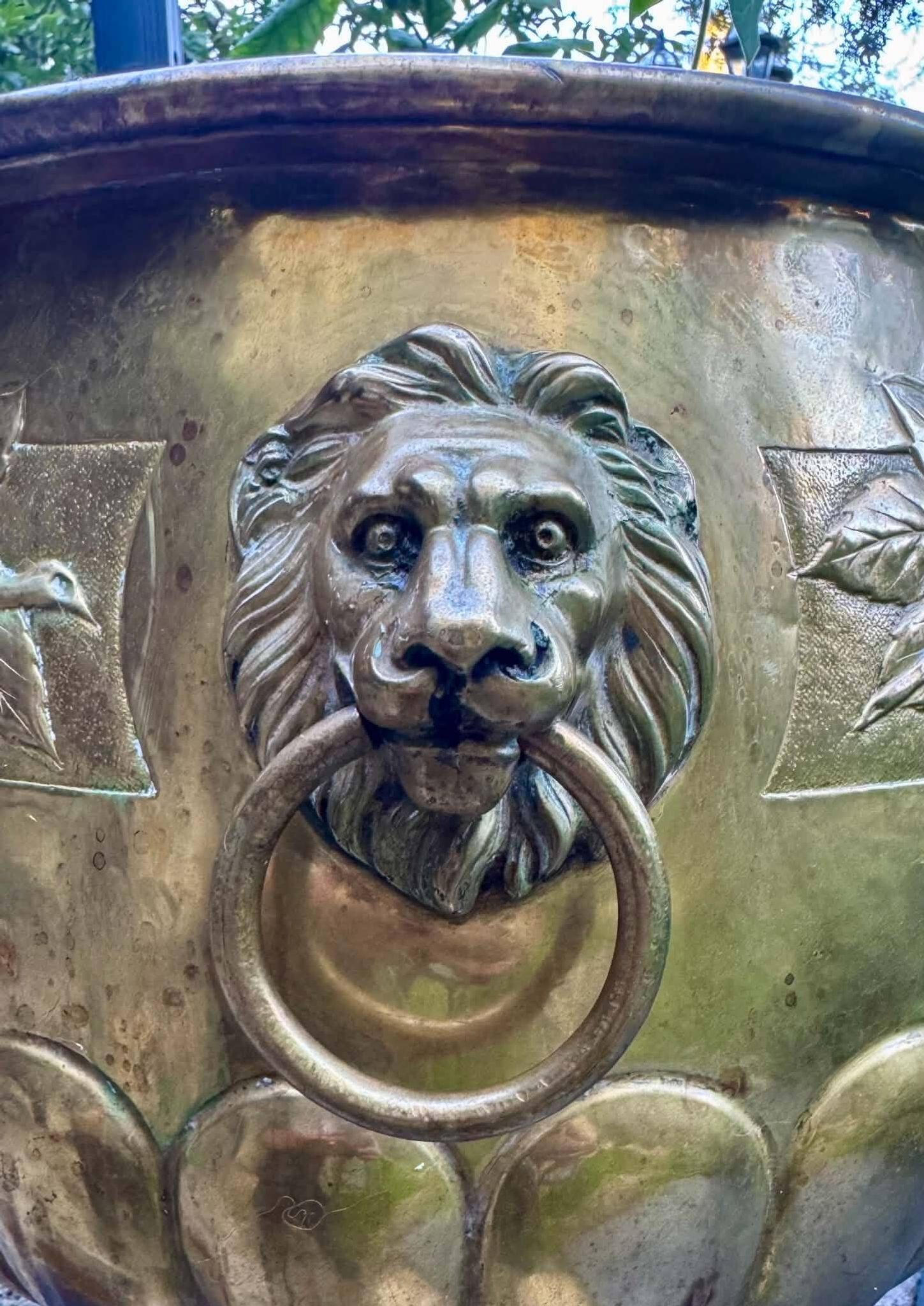 Large brass lion planter with a hallmark from the 19th century.