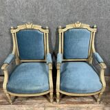 Pair of Louis XVI style armchairs in molded, carved wood