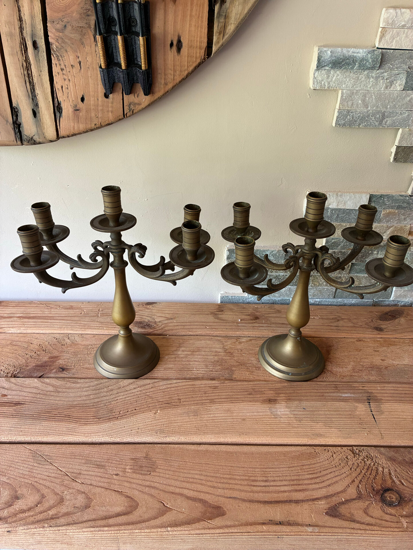 Pair of large 5-light candlesticks in patinated brass, classical style.