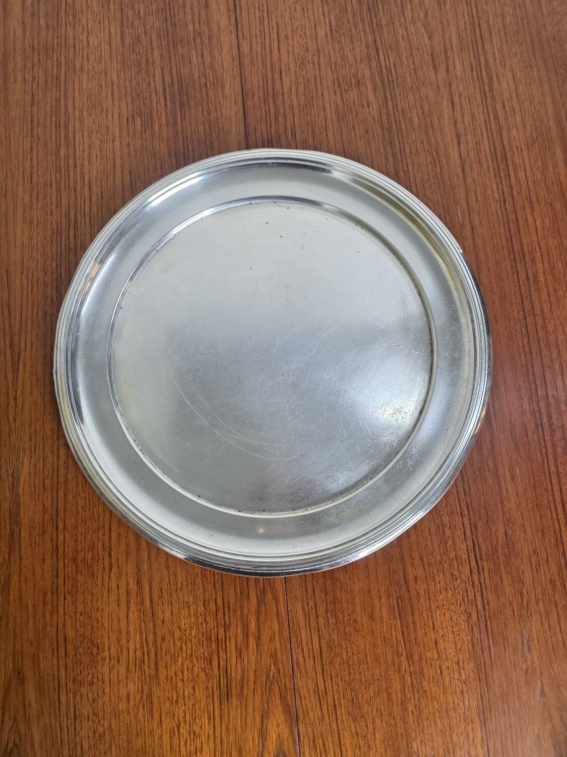 Round silver-plated metal tray from the mid-20th century
