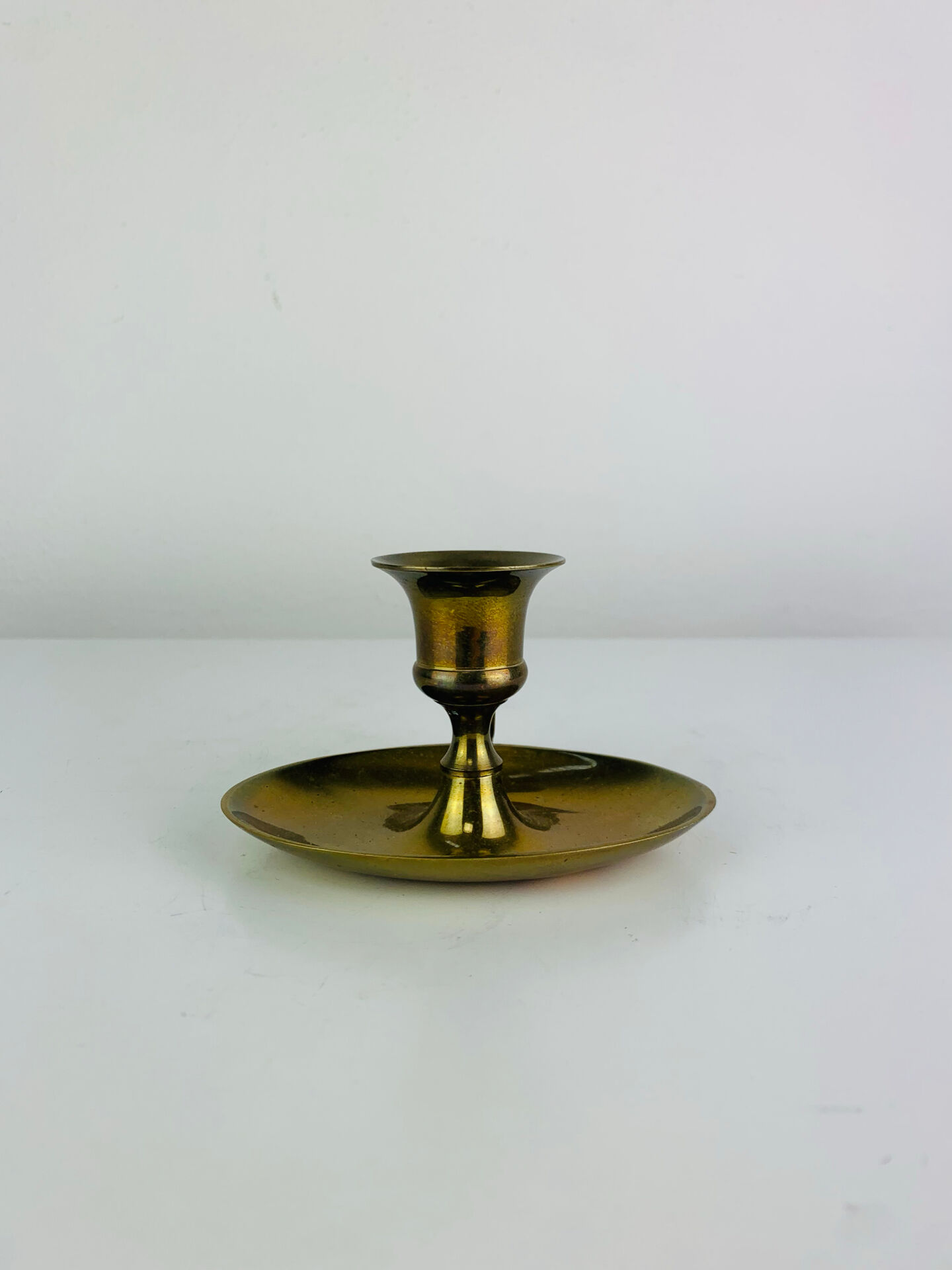 Vintage brass candlestick, rat of the cellar.