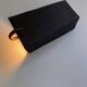 Pair of black stoneware graphic wall lights with handmade ring.