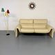 Two-seater designer sofa De Sede DS-2011 in cream leather with adjustable backrest.