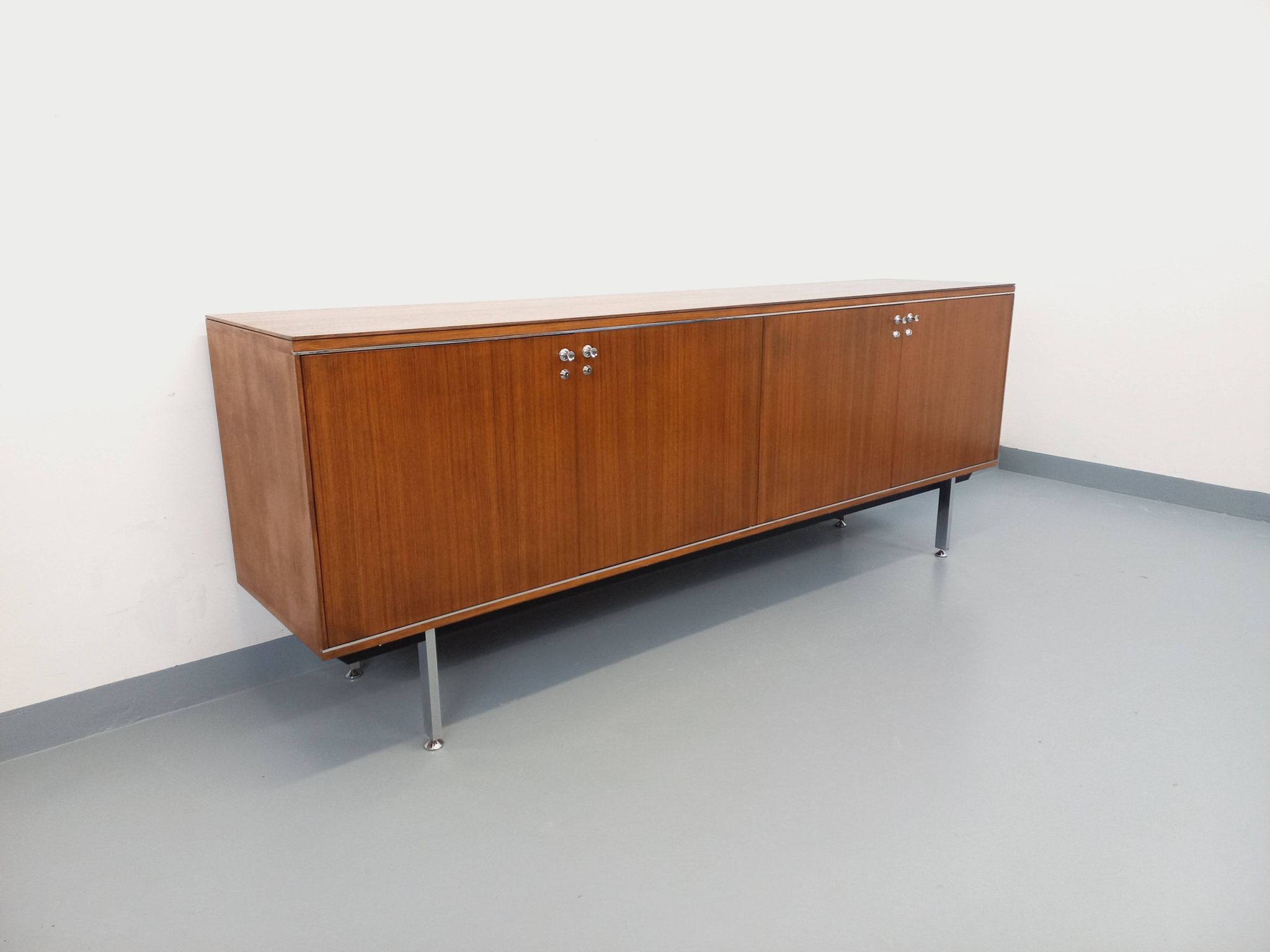Vintage modernist enfilade in rosewood and chrome metal from the 60s and 70s.