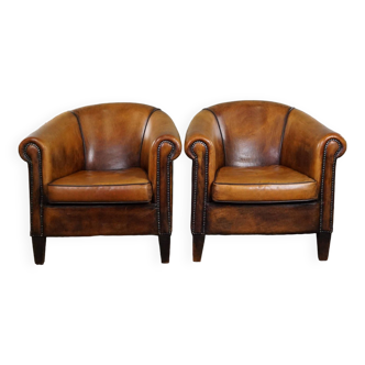 Ensemble de deux fauteuils club vintage en cuir de mouton