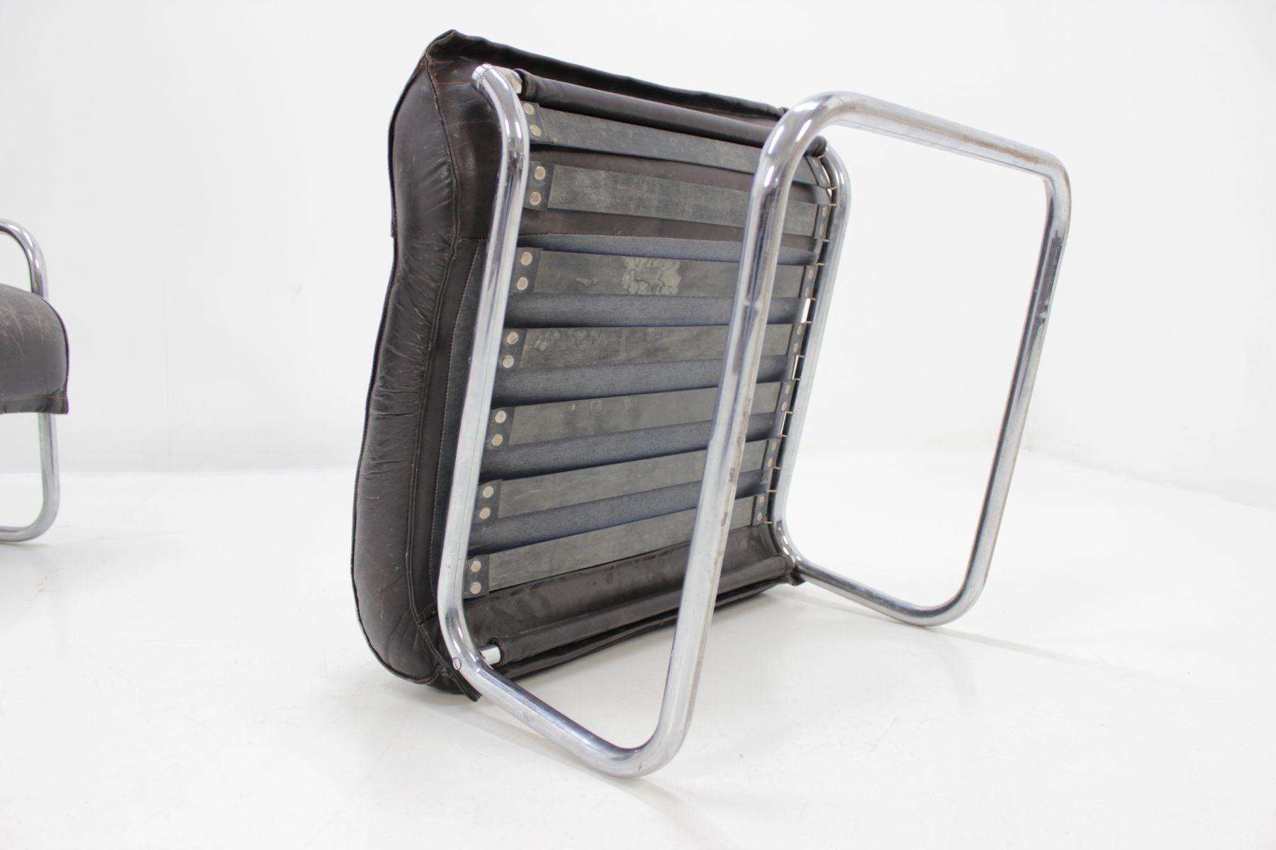 Chair and Ottoman in leather 1950 s