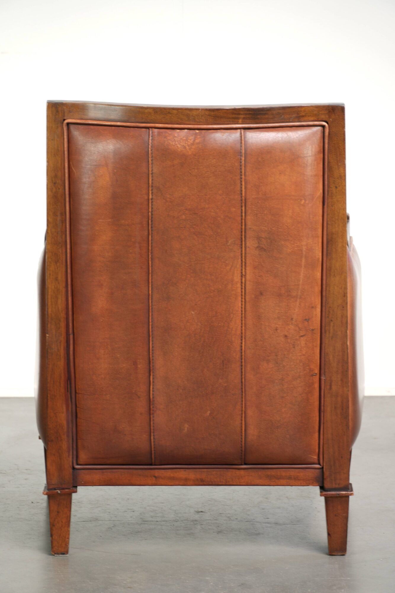 Sheepskin Art Deco design armchair with a comfortable seat and warm colours