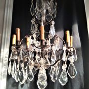 Old chandelier with tassels, bronze and crystal, 8 lights. Louis XV style.