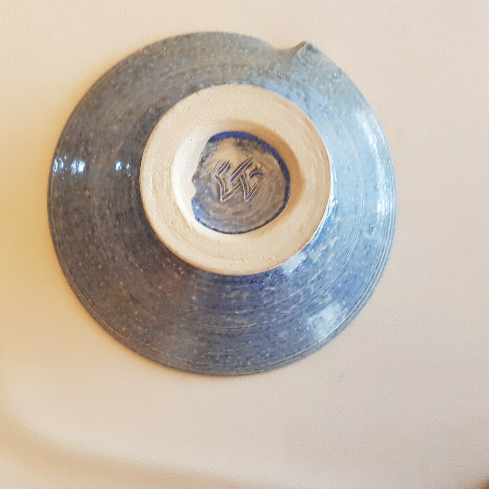 Empty pocket bowl cup on ceramic pedestal with signed spike holes