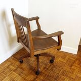 Oak wood office chair with swivel seat and swivel wheels