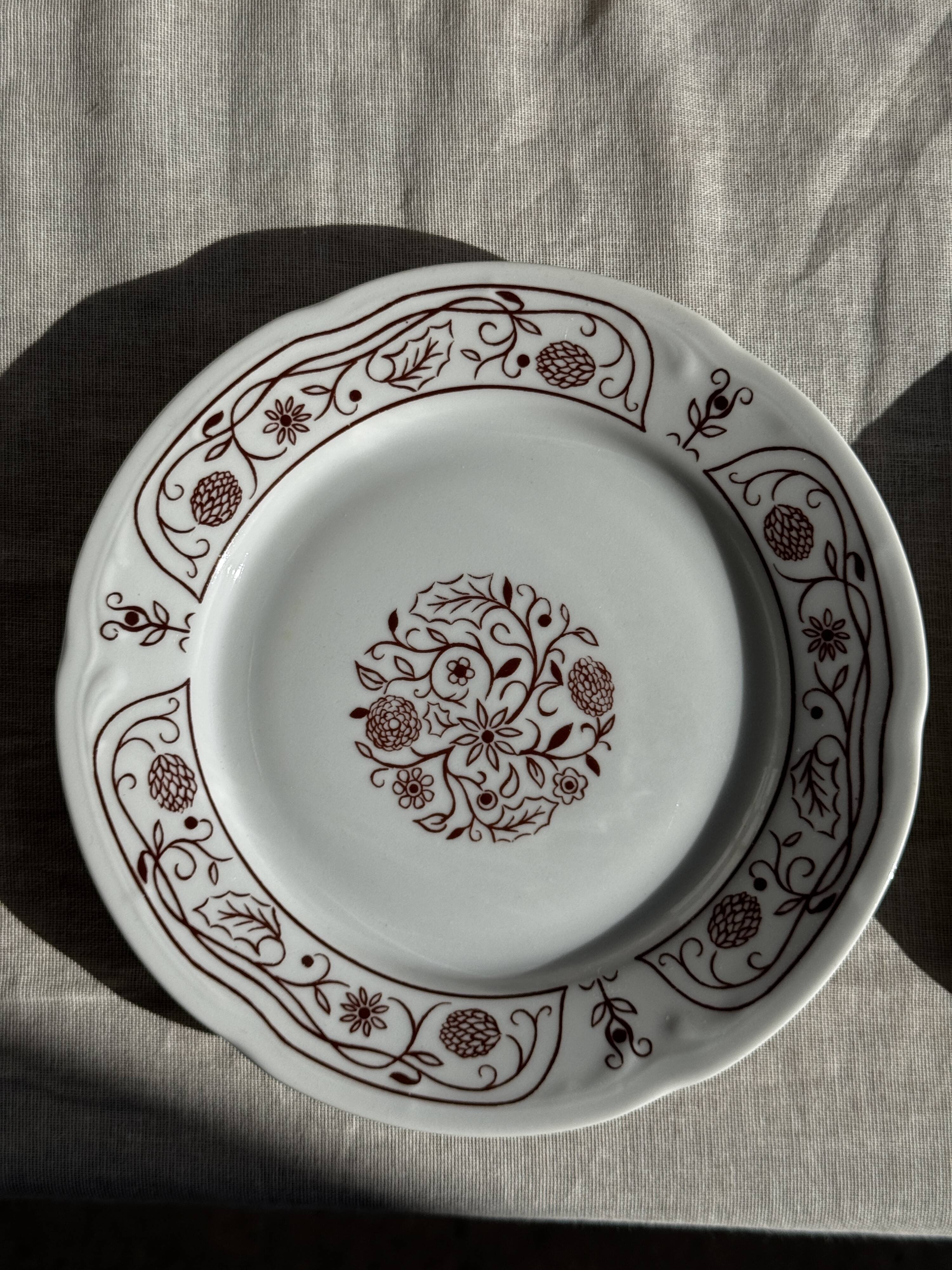 Set of 6 vintage dessert plates made in Poland with a plant motif.