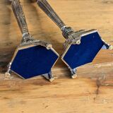 Pair of chiseled metal candle holders