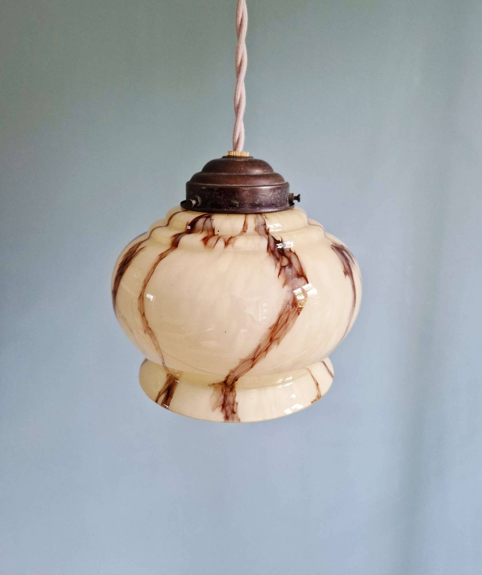 Trio of Art Deco marbled opaline pendant lights, 1920-30