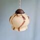 Trio of Art Deco marbled opaline pendant lights, 1920-30