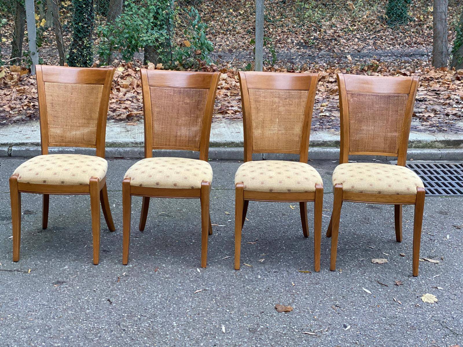 Four 20th-century Directoire-style chairs in solid wood with cane seats and beige fabric