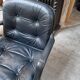 Pair of Comforto armchairs in black leather. Vintage 70s.