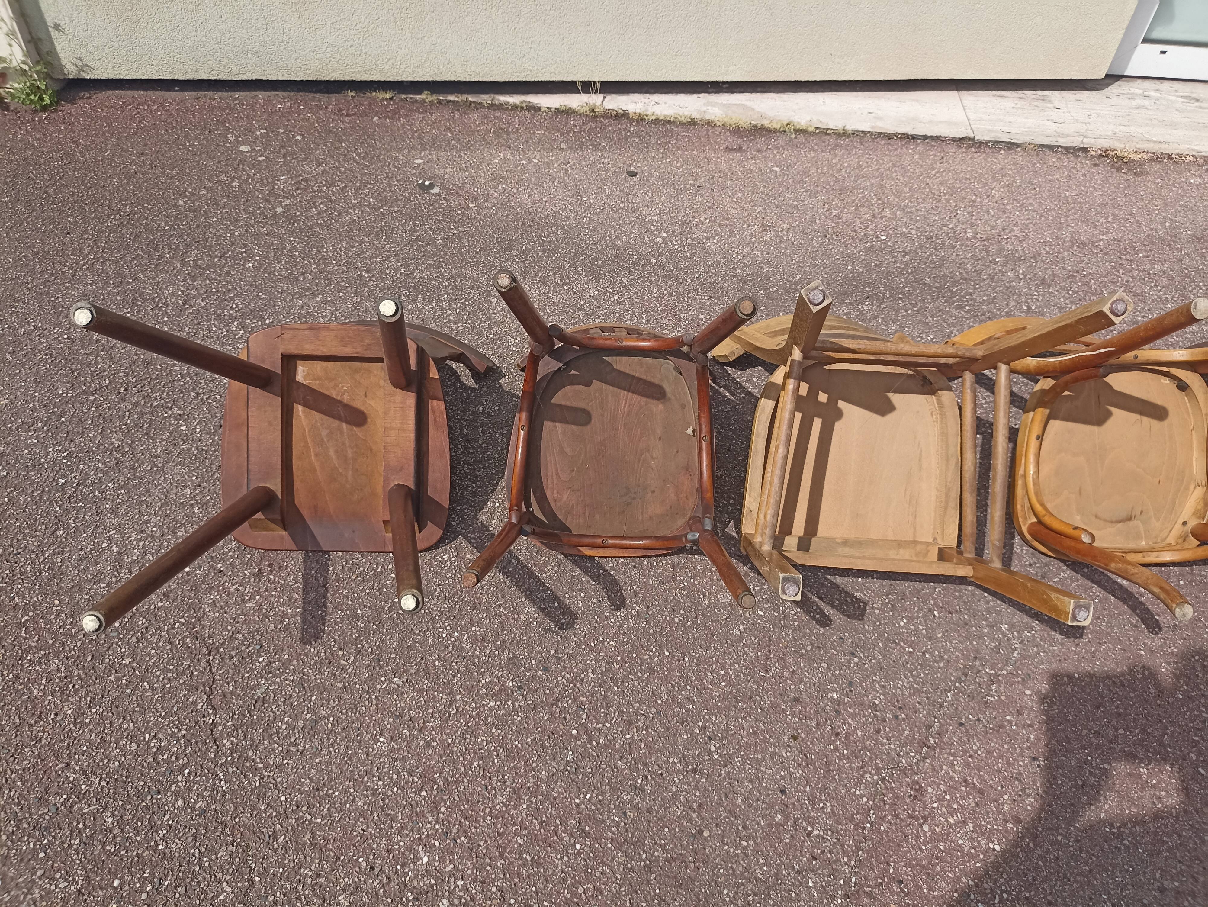 Set of 12 mismatched wooden bistro chairs