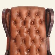 Fauteuil à bascule avec repose-pieds, bois et cuir capitonné