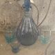 Liquor service consisting of a blue glass decanter and. 3 small antique glasses