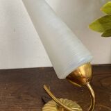 Gold metal wall light with ribbed glass.