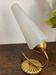 Gold metal wall light with ribbed glass.