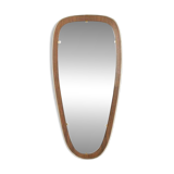 Wonderful 1950s mirror on a teak wood panel with brass frame. Made in Germany