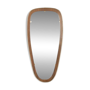 Wonderful 1950s mirror on a teak wood panel with brass frame. Made in Germany