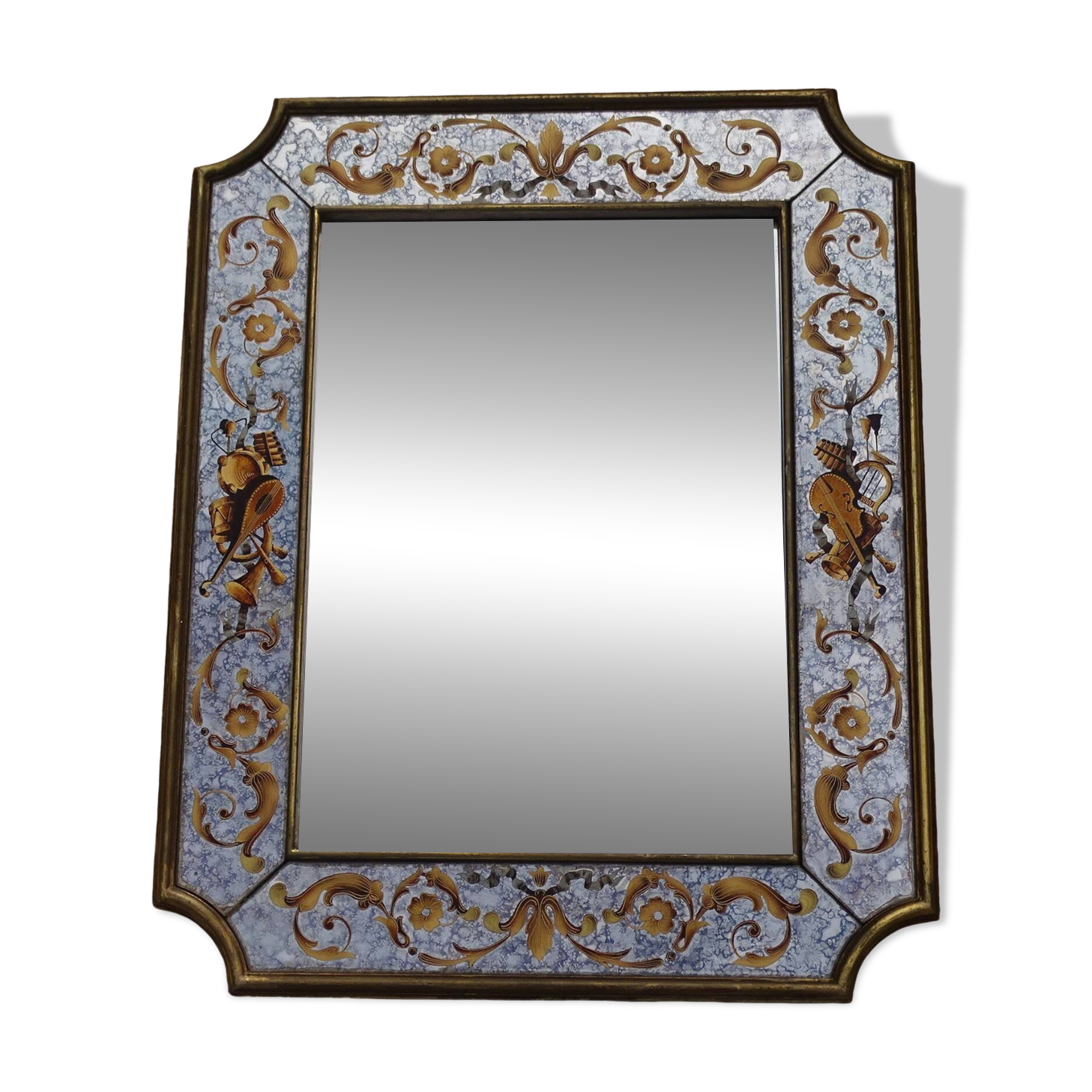 50s Eglomisé glass mirror with musical instrument decor