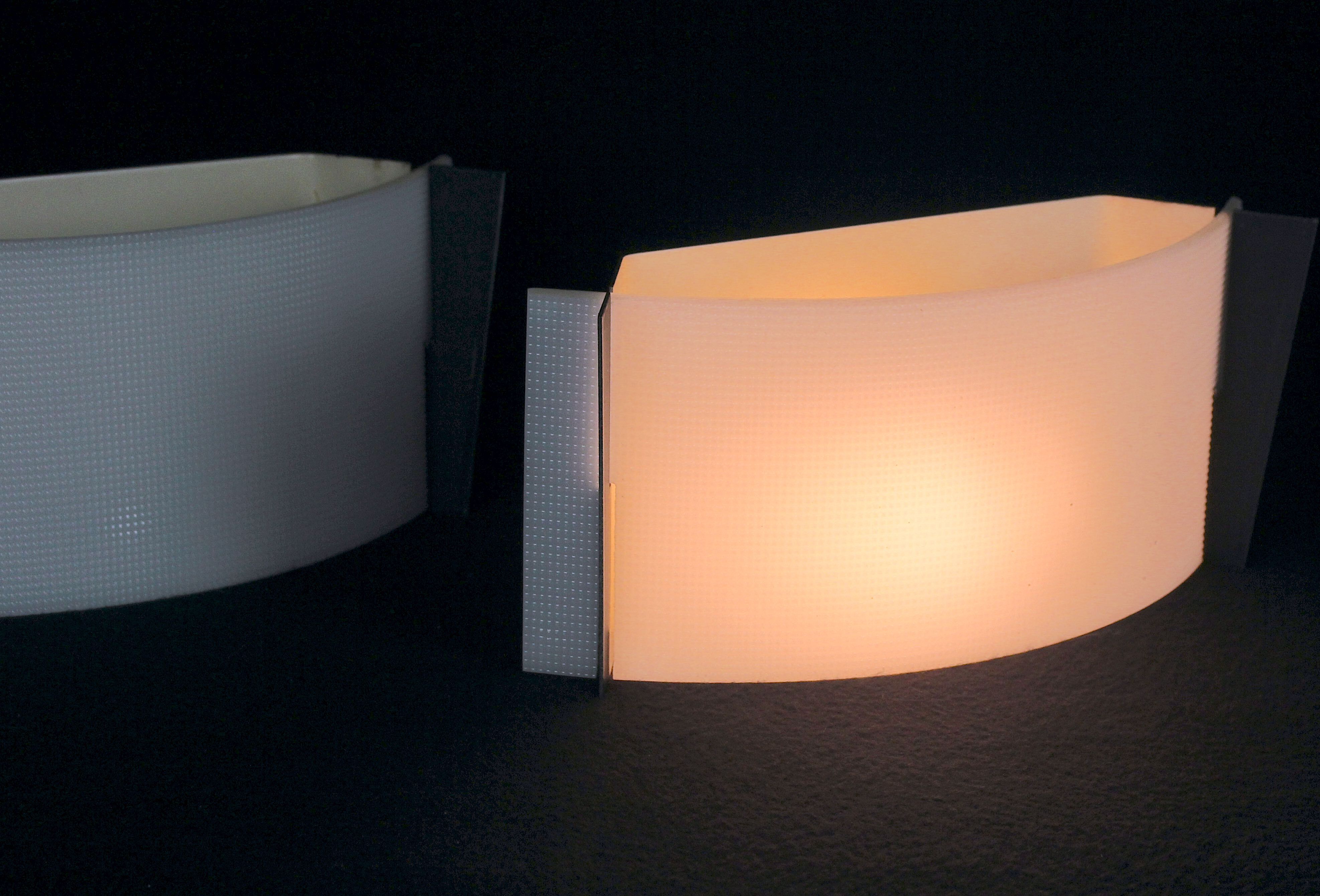 Pair of mid-century wall lamps in black metal and perspex, france