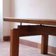 Large solid retractable coffee table
