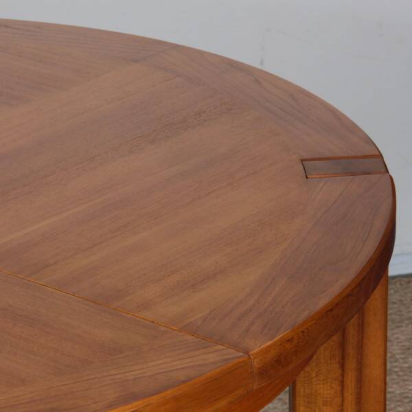 Round extendable dining table in wood published by Monopoly, 1970.